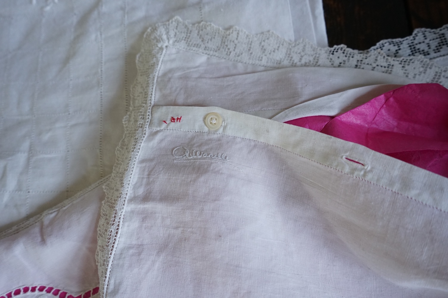 A late 19th century early 20th century finely woven, hand worked linen sheet 6’8”wide, together with a near matching large square pillowcase. Both items worked in Embroidery Anglaise, button holed and inset and trimmed w